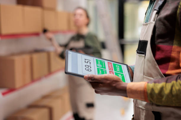 istock Stockroom manager holding digital device 1481634876