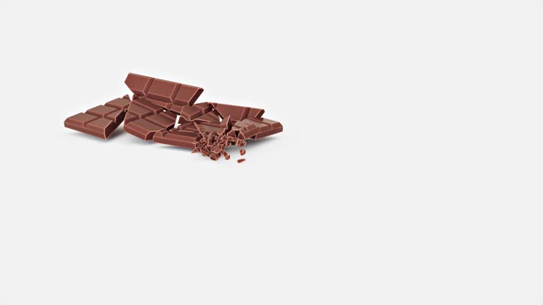 chocolate bar falling and breaking on white slow motion