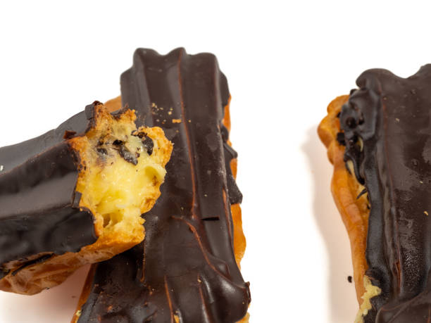 istock Delicious chocolate eclairs isolated on white background. 1481636947
