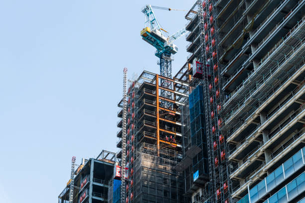 istock Building construction site and cranes with the blue sky background 1481639951