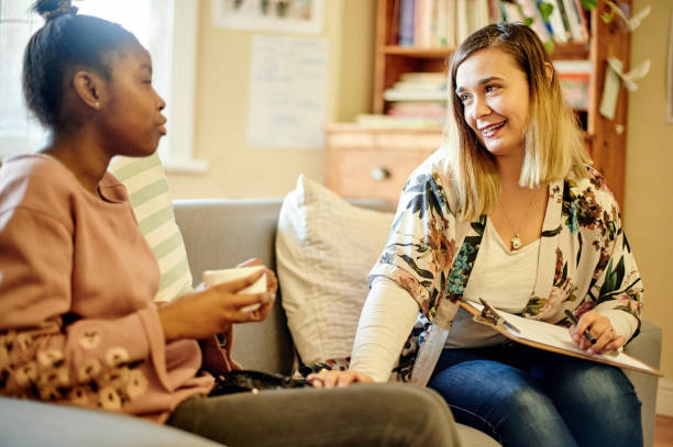 istock Clipboard, child and psychologist woman talking, support and help with checklist, evaluation or assessment therapy. Tea, empathy and relax therapist person and african kid in consultation discussion 1481640409