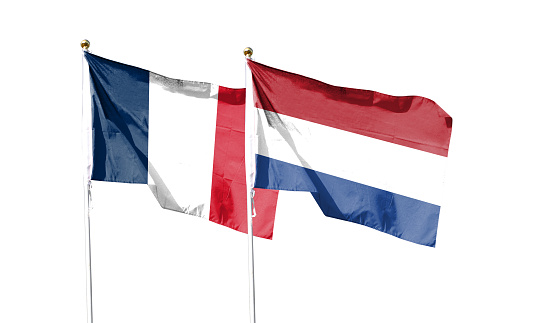France flag and Netherlands flag on cloudy sky. waving in the sky