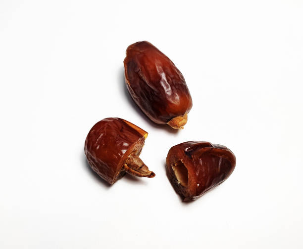 istock Close up of dried dates fruit isolated on white background 1481641939