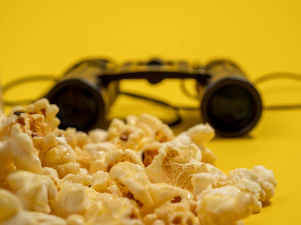 istock Popcorn on a yellow background. Sweet popcorn on yellow. 1481642130