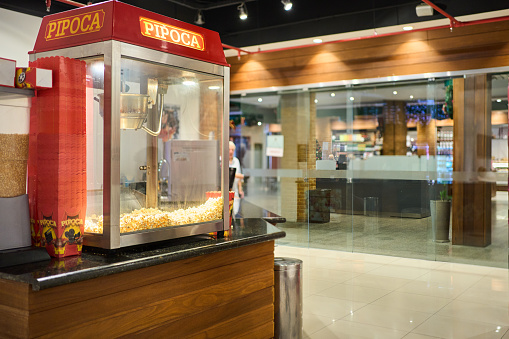 Fresh popcorn for sale on concession stand in a movie theater