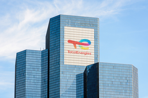 Puteaux, France - April 9, 2023: Top of the Coupole tower, head office of the french oil company TotalEnergies in Paris La Defense business district.