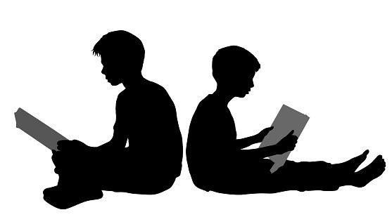 Reading Buddies: Vector Silhouette Illustration of Two Boys Sitting and Engrossed in a Book Together