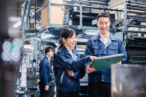 istock Staff discussing at the factory while looking at a tablet 1481654247