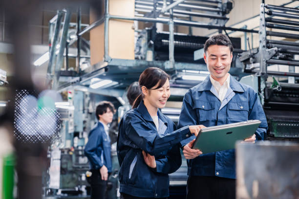 istock Staff discussing at the factory while looking at a tablet 1481654263