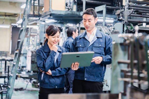 istock Staff discussing at the factory while looking at a tablet 1481654268