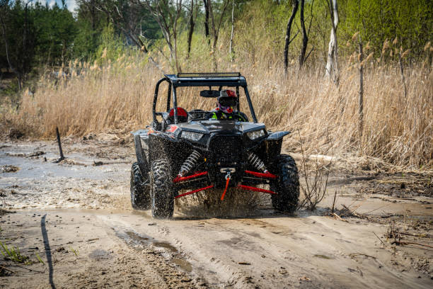 istock Cool view of active 4x4 vehicle driving in mud and water at spring 1481656353