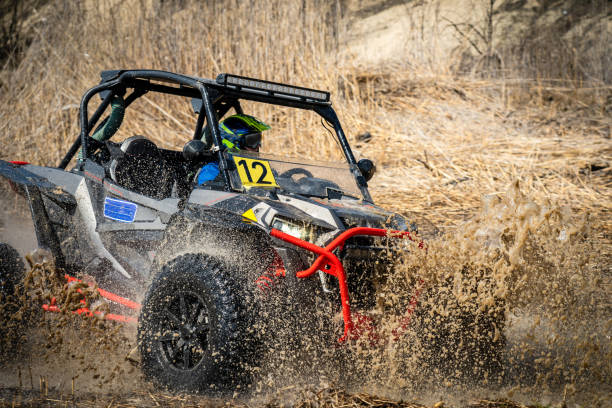istock Active ATV and UTV Off-Road vehicle in muddy water. ATV 4x4 1481656383