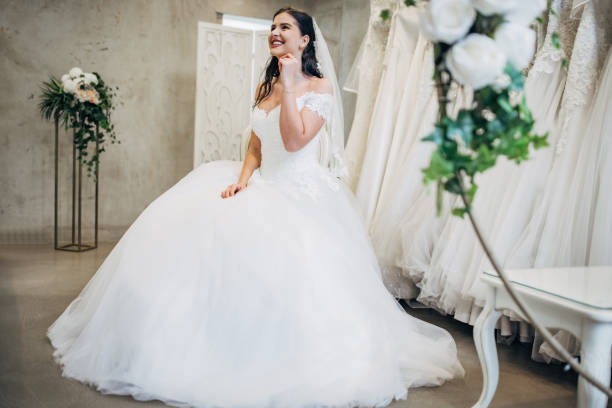 istock Bride trying out wedding dressing the bridal shop 1481663309