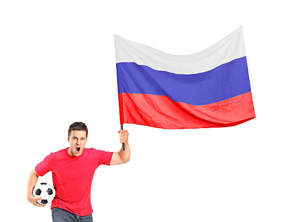 istock Euphoric fan holding a ball and waving russian flag 148166563