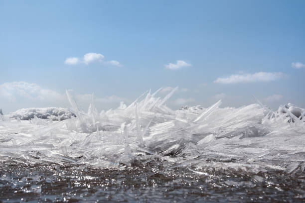 Ice hummocks on the river. Transparent needle ice.