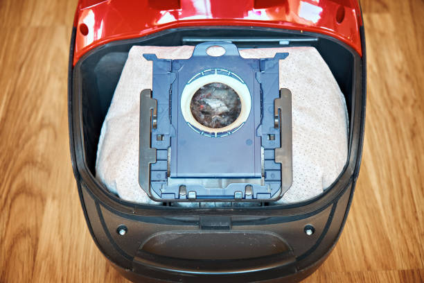 istock A bag with dirt for a vacuum cleaner. Close-up 1481673322