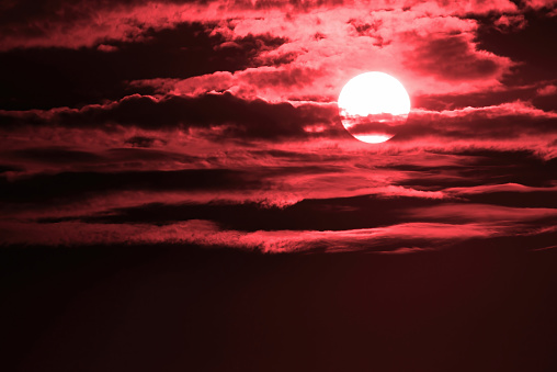 Big Setting Sun in Dark Red Clouds