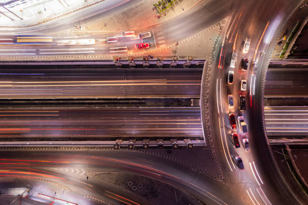 istock Expressway top view, Road traffic an important infrastructure, Drone aerial view fly in circle, traffic transportation, Public transport or commuter city life concept of economic and energ, transport. 1481677056