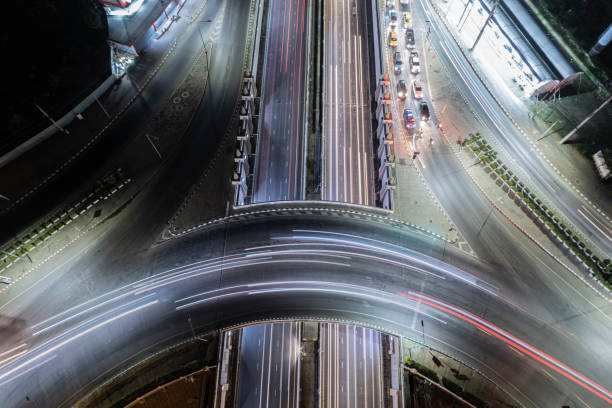 istock Expressway top view, Road traffic an important infrastructure, Drone aerial view fly in circle, traffic transportation, Public transport or commuter city life concept of economic and energ, transport. 1481677072