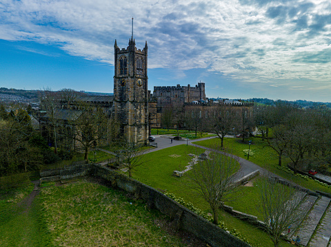 Aerial photograph of Lancaster Priory Church and Castle. The Priory Church was formerly known as Saint Mary’s Priory Church. I go The photograph was taken on a bright day in early April 2023. The surrounding countryside can be seen in the distance