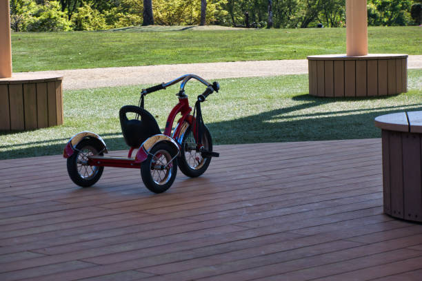 A cool red tricycle to ride in the park
