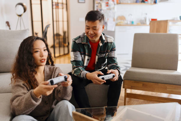 istock Couple in love having fun, playing video games 1481686323