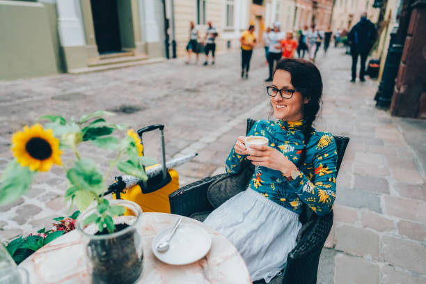 istock Tourist drinking coffee at sidewalk cafe in Krakow 1481686841