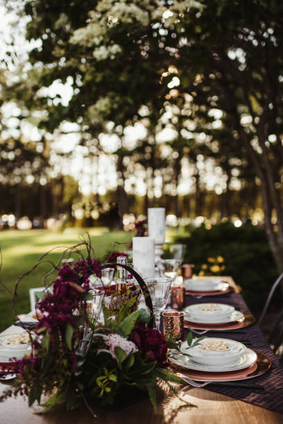 istock Side view of dinner table set up for a wedding reception 1481687055