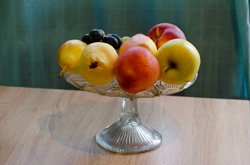 A group of different fresh ripe fruits - apple, peach, grapes and pears in a fruit bowl, Sofia, Bulgaria