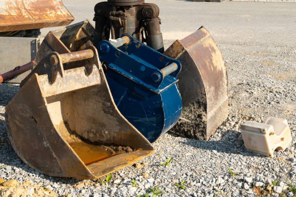 istock Dirty excavator buckets standing on a construction site. 1481688459