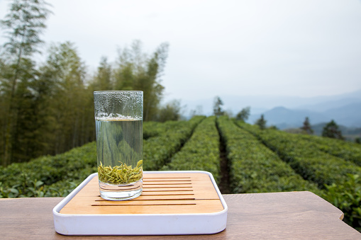 Organic hot green tea drink in ceramic cup isolated on white background, clipping path included