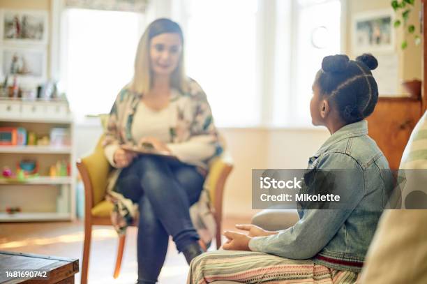 Psychologist Black Girl And Consultation In Office For Support Help Or Mental Health Psychology Therapist Or Kid Or Child Consulting Woman For Counselling Therapy Or Talking For Advice In Clinic Stock Photo - Download Image Now