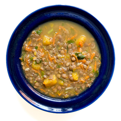 hearty homemade lentil soup on a white plate