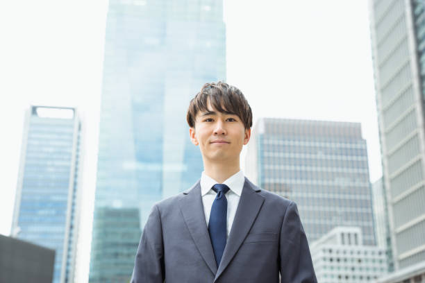 istock A man in a suit in his 20s and 30s with a serious expression in a business district 1481692637