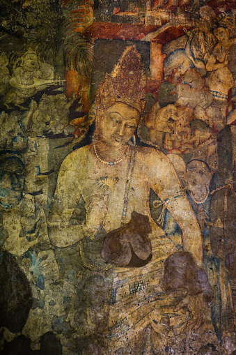 The 5th-century Bodhisattva Padmapani painting depicting Gautama Buddha holding a lotus flower at Ajanta Caves, Maharashtra, India.