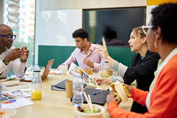 istock Colleagues eating lunch and debating ideas 1481695661