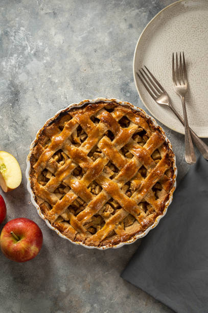 istock Whole apple pie, homemade fresh fruit pie with red apples, top view 1481702776