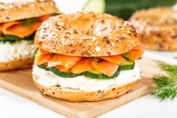 istock Bagel sandwich with salmon and cream cheese for breakfast on a kitchen board 1481705703