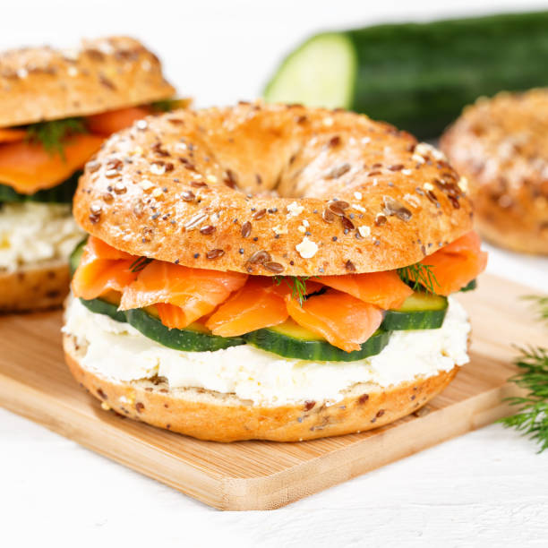 istock Bagel sandwich with salmon and cream cheese for breakfast on a kitchen board square 1481707259