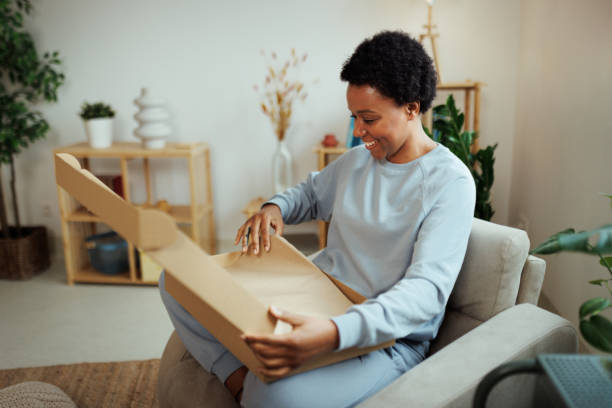 istock Overjoyed young woman opens box parcel feels satisfied 1481709613