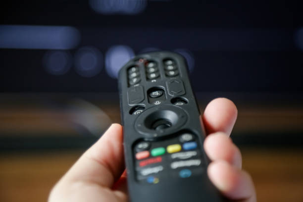 istock TV control in one's hand pointed to open the Streaming channel. 1481709620