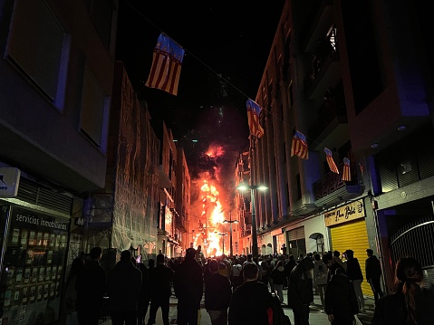 Gandia, Comunidad Valenciana, Spain - March 20, 2023: Ninots burning at Cremá, is the last event of Fallas de Valencia festival, when the Ninots are burning around the city with a fireworks display over the sky.

Las Fallas or 