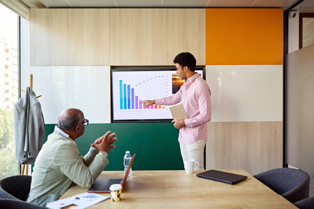istock Businessmen discussing data in meeting room 1481712001