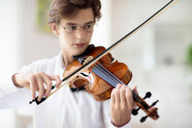 istock Man playing violin. Classical music instrument. 1481712882