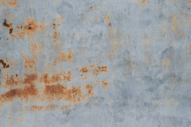 istock Scratched, stained, rusty sheet metal plate painted in light blue background texture 1481716192