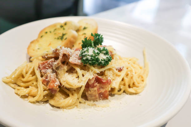 istock bacon spaghetti, spaghetti carbonara or pasta or pasta carbonara and bread 1481716539