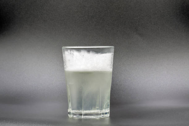 istock Dissolving instant effervescent tablets in a glass of water closeup 1481716862