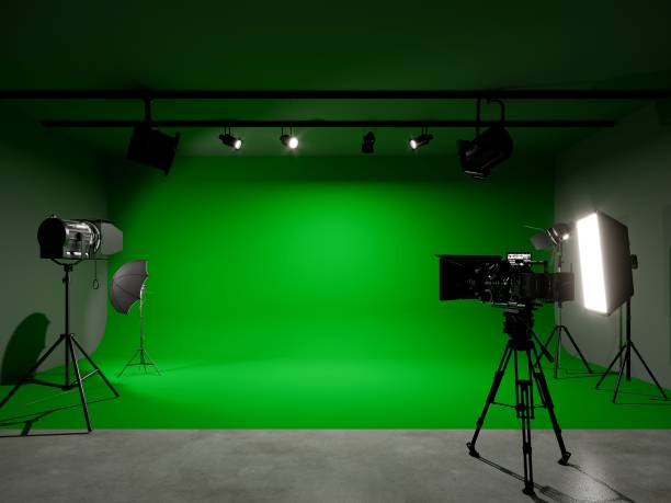 istock green screen photo studio with lighting and movie camera. 3D rendering 1481719183