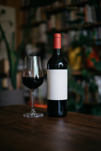 istock Red wine glass and wine bottle with blank white sticker 1481726926