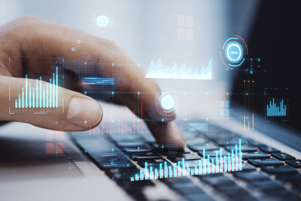 istock Close up of male hand using laptop keyboard with glowing digital business interface with charts on blurry office background. Infographic and big data concept. Double exposure. 1481728072